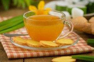 Fresh ginger tea, a powerful Ayurvedic home remedy for bloating and digestion.
