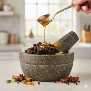 A stone mortar and pestle containing dark raisins being coated in golden honey for a natural cough remedy.